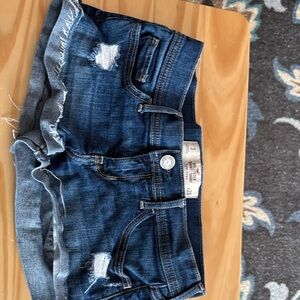 Hollister short- short low rise Dark Wash Distressed Denim Cutoff Shorts.